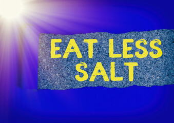 Writing note showing Eat Less Salt. Business concept for reducing the sodium intake on the food and...