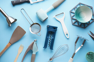 Kitchen utensils on a blue background. Flat lay.