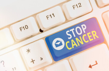 Writing note showing Stop Cancer. Business concept for prevent the uncontrolled growth of abnormal...