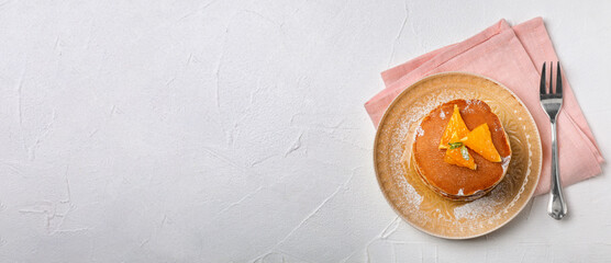 Tasty pancakes served on light table, top view with space for text. Banner design