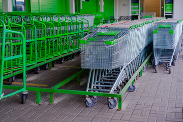 parking for shopping baskets. shopping in the supermarket. parked baskets.empty parking lot....