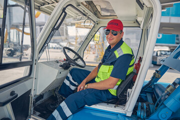 Calm airport worker sitting in a car