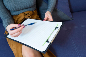 Notepad for writing in the female hands of the doctor. Psychotherapy social problems addiction...