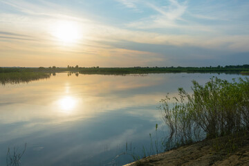 Landscape of the sky above the river, summer sunset. River landscape in summer, fog view