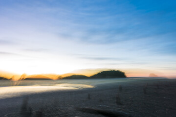 Defocused blue dawn at Puponga Beach, New Zealand
