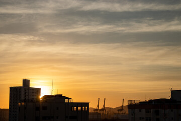 Fototapeta na wymiar sunset over the city silhouette