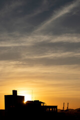 Fototapeta na wymiar sunset over the city silhouette