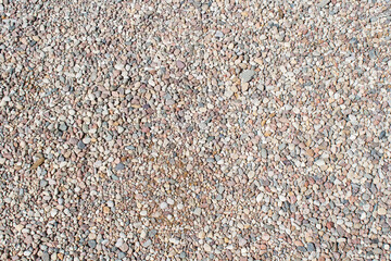 Gravel texture Small stones, little rocks, pebbles in many shades of grey, white, brown, pink...
