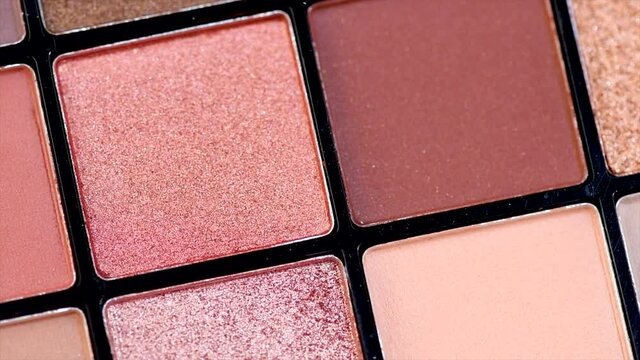 Make up palette set. Professional multicolor eyeshadow palette. Makeup. Professional multicolor eyeshadow make-up palette background, close-up. Colorful bright eye shadows set backdrop. 4K UHD video 