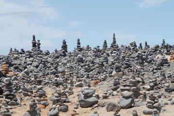Many rock stacks on beach