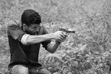 Black and white portrait of a fighter with a pistol