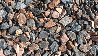 Fine natural multi-colored stone. Mulch for landscape design. Texture background