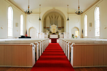 A red carpet leads down the center aisle in the Congregational Church Fairfield, Connecticut