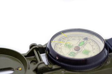 Closeup green color military compass on isolated white background.