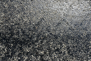 bitumen on the asphalt road, which melts due to the heat in the summer, melted pitch and asphalt road, hot and melted asphalt roads,