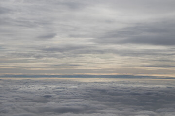 beautiful white clouds on blue sky, view from airplane window