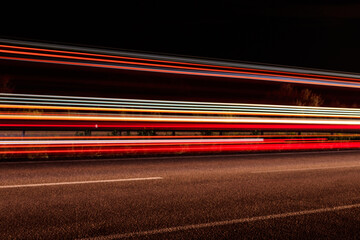Traffic light trails on a highway at night