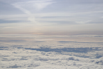 Naklejka premium beautiful white clouds on blue sky, view from airplane window