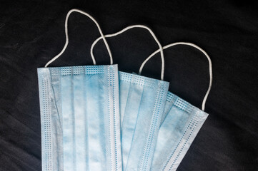 Background concept for news about the novel coronavirus COVID-19 pandemic, antiviral medical mask...
