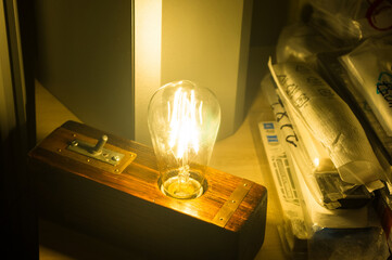 Light fixture handmade in vintage style, wooden case, copper finish