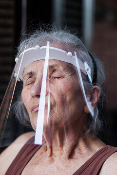 Portrait Of Old Woman Wearing A Protective Visor