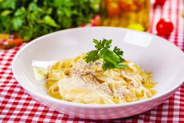 Italian Pasta with cheese on white plate. Close up