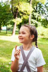 little cute caucasian girl playing cheerful in green park at summer, lifestyle people concept