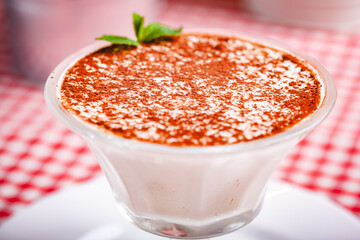 Tiramisu in portion glass. Close up