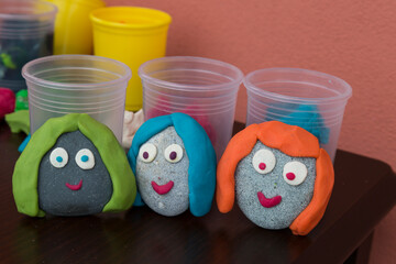 Playing with stones and play dough for children’s activities in preschool or nursery.creative ideas for child development.back to school and happy teachers day concept.