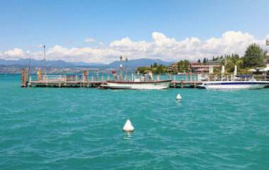 Fototapeta na wymiar SIRMIONE, ITALY - JUNE 19, 2020: beautiful view of Lake Garda from Sirmione, Italy