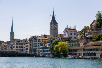 Fototapeta na wymiar Cityscape of Zurich and river Limmat in daytime with blue sky, Switzerland