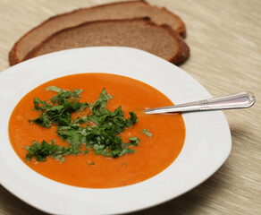 closeup of a bowl with pumpkin soup