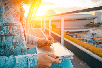 Student woman person work on tablet, computer in summer park. Online girl in nature outside. Laptop outdoor business technology. Electronic gadgets distance learning concept.