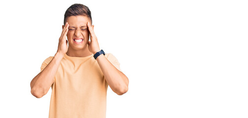 Young handsome man wearing casual clothes with hand on head, headache because stress. suffering migraine.