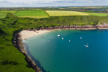 Aerial view of a small sandy bay in Wales