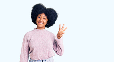Young african american girl wearing casual clothes showing and pointing up with fingers number three while smiling confident and happy.