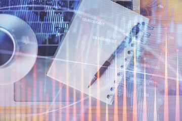 Multi exposure of forex chart drawing and work table top veiw. Concept of financial analysis.