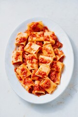rustic italian paccheri pasta in tomato sauce
