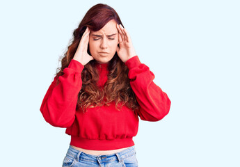 Young beautiful woman wearing casual winter sweater with hand on head for pain in head because stress. suffering migraine.