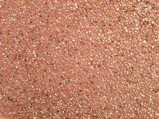 Red pebble wall, natural light, used as wallpaper, modern graphic design, wide backdrop
