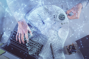Double exposure of man's hands typing over computer keyboard and brain hologram drawing. Top view. Ai and data technology concept.