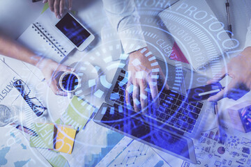 Double exposure of man's hands typing over computer keyboard and data theme hologram drawing. Top view. Technology concept.