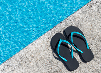 Flip flops on the edge of a pool
