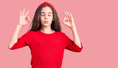 Cute hispanic child girl wearing casual clothes relax and smiling with eyes closed doing meditation gesture with fingers. yoga concept.