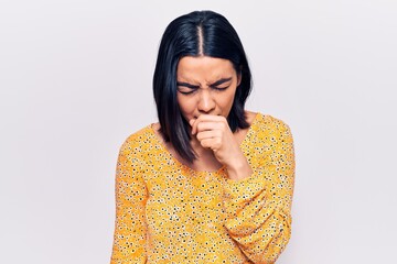 Young beautiful latin woman wearing casual clothes feeling unwell and coughing as symptom for cold...
