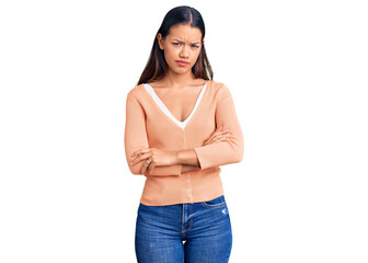 Young beautiful latin girl wearing casual clothes skeptic and nervous, disapproving expression on...