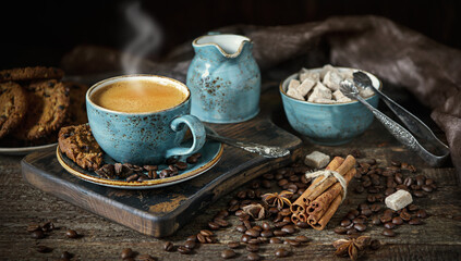 Blue coffee Cup on a wooden Board, coffee beans, sugar, flavor, chocolate cookies, vintage, retro, dark, craft
