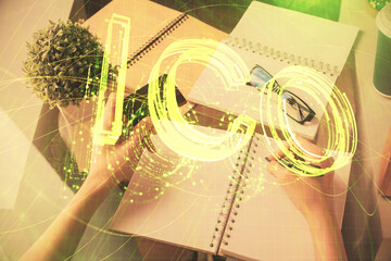 Multi exposure of woman on-line shopping holding a credit card and crypto theme drawing. Blockchain...