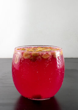 Tuba, Traditional Drink From Colima Mexico, Refreshing, Pink With Peanut And Apple In Overhead Shot With A White Background