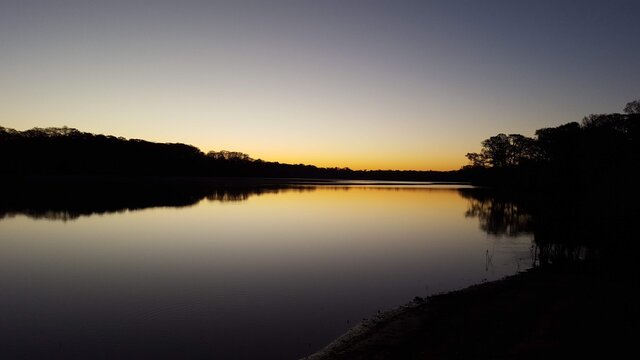 Dark Sunset on the water © Eden